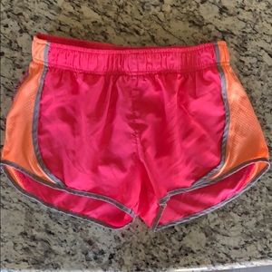 Bright pink and coral running shorts